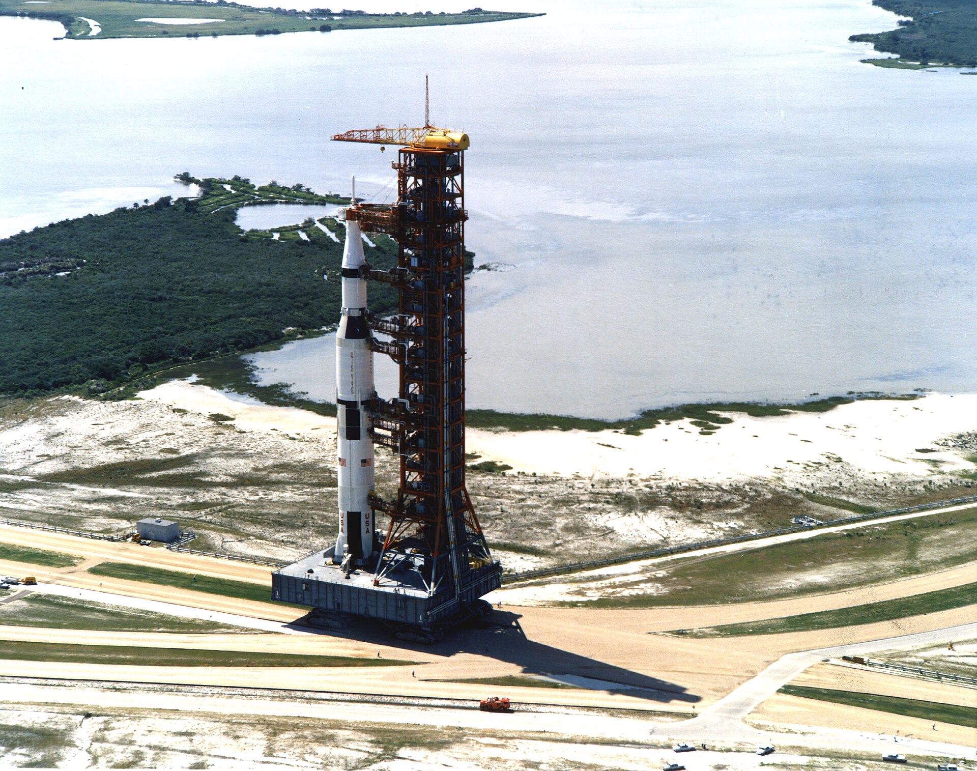 Saturn V rolling out of the Vehicle Assembly Building toward Pad 39A.